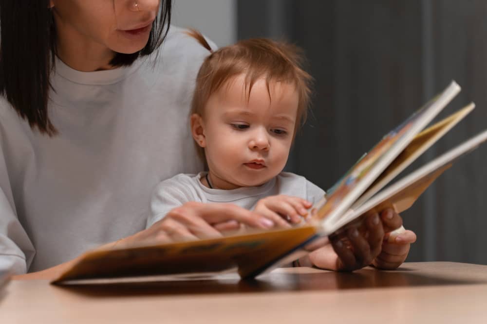 Parent talking and smiling with baby