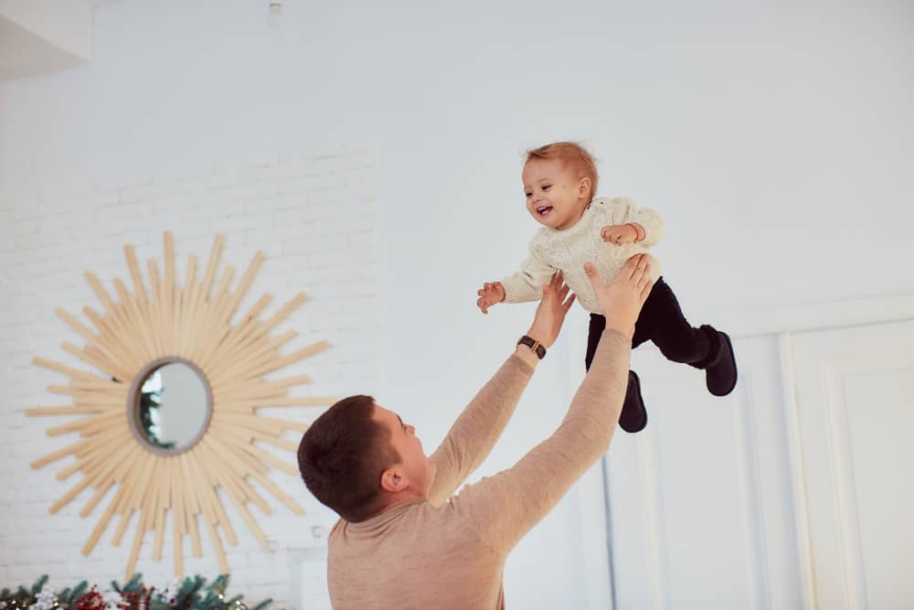 Modern minimalist baby name typography with upward arrows and soft pastel colors