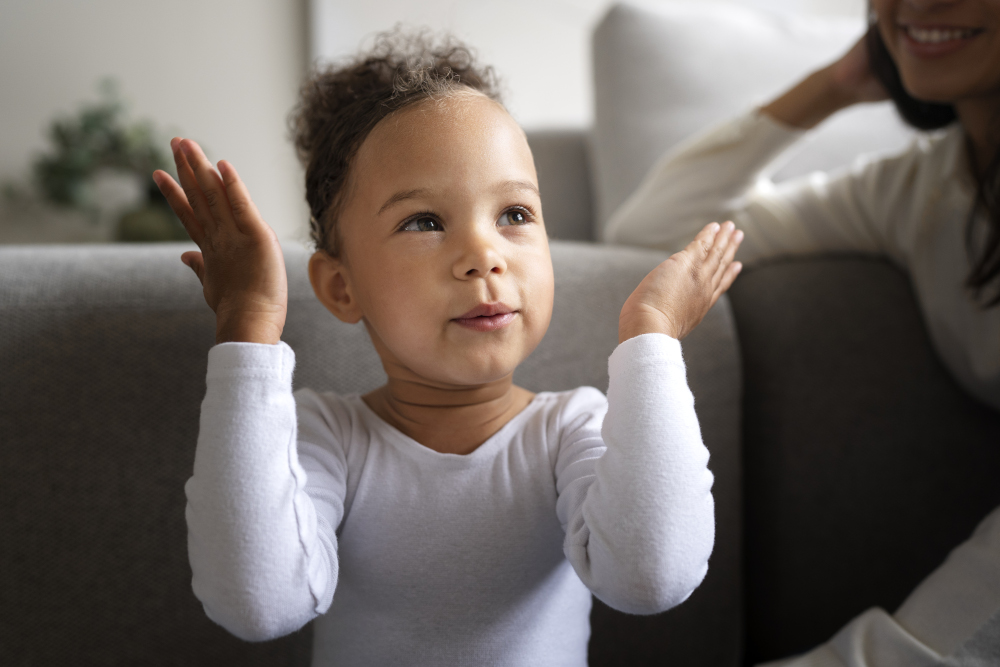 Baby babbling and smiling while a parent talks back
